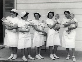nurses holding babies