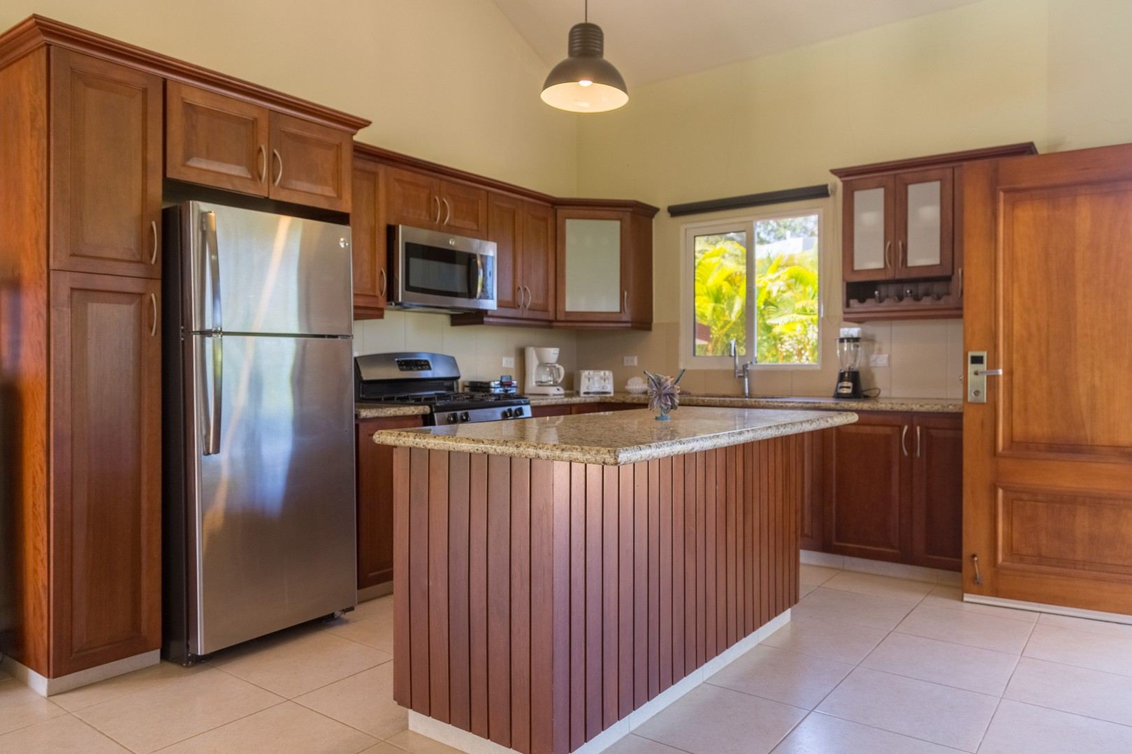 The villa kitchen in fine wood and stainless steel appliances