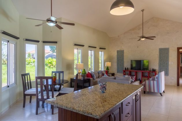 The villa kitchen island has granite top